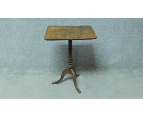 A 19th century oak tilt top occasional table on tripod cabriole supports. H.71 W.56 D.49cm 