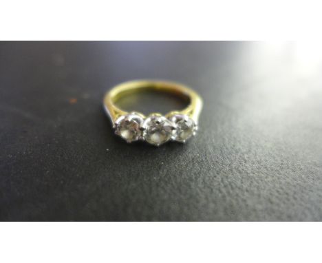 An 18ct yellow gold three stone diamond ring, approx total 1.0ct diamonds, size L, approx 3.9 grams - in good condition - sto