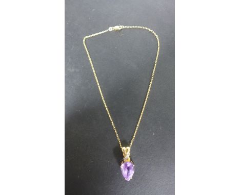 A 9ct Yellow Gold pear-shaped Amethyst Pendant on a 9ct chain - 40 cm long, pendant 3 cm - total weight approximately 10.5 gr