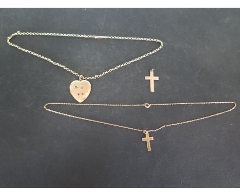 A 9ct yellow gold crucifix on matching chain, a single 9ct gold crucifix and a 9ct gold plated locket on a 9ct gold chain - t