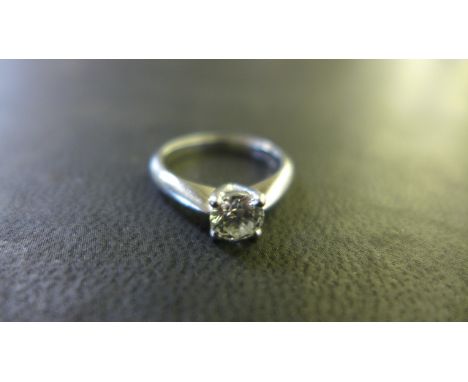 A Platinum Solitaire Diamond Ring - brilliant cut diamond - approximately 0.6ct - colour G-H, clarity VSI, ring size J, appro
