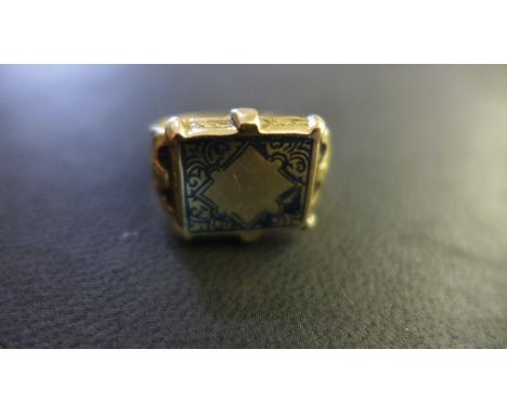 A Gold Ring - believed to be 18ct gold, with engraved decoration - size N - approximately 7.5 grams - some enamel wear and us