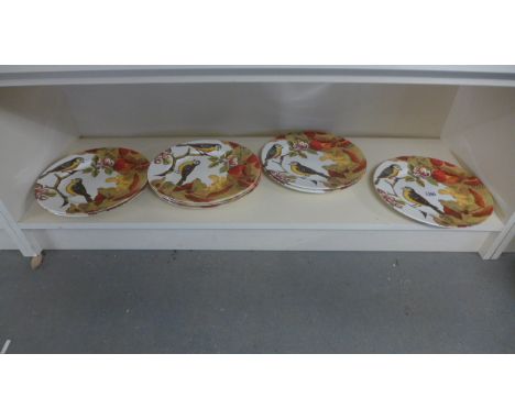 Nine Poole Pottery large plates beautifully decorated with colourful birds