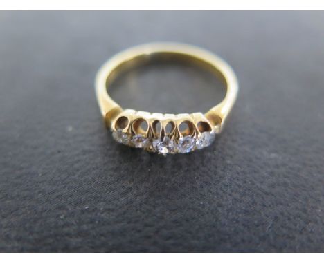 A yellow gold five stone diamond ring size N - approx weight 3.4 grams - tests to approx 18ct gold - some usage wear