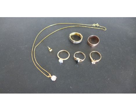 A quantity of 9ct Yellow Gold jewellery items to include a wedding band, three solitaire rings, a pendant and chain, a single