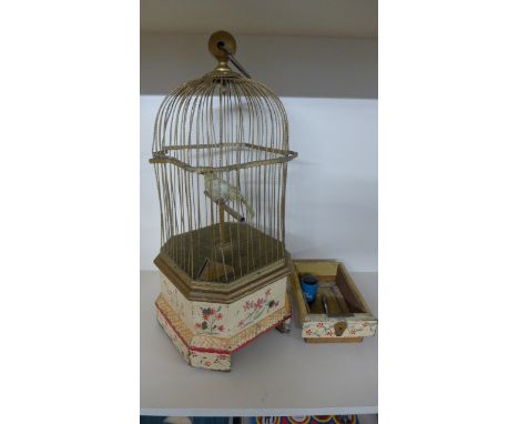A 19th Century Clockwork Bird in a Cage - Automaton with Coin Operation - 56 cm tall x 25 cm x 25 cm - coin drawer has been a