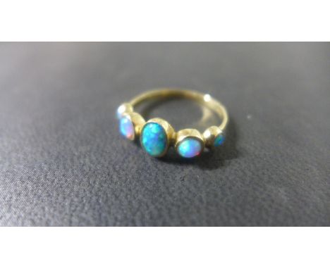 A 9ct yellow gold opal effect ring size P - approx weight 1.6 grams - some usage, generally good