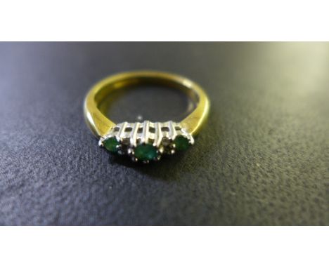 An 18ct yellow gold diamond and emerald ring - size N - approx 4 grams - generally good condition - some usage marks