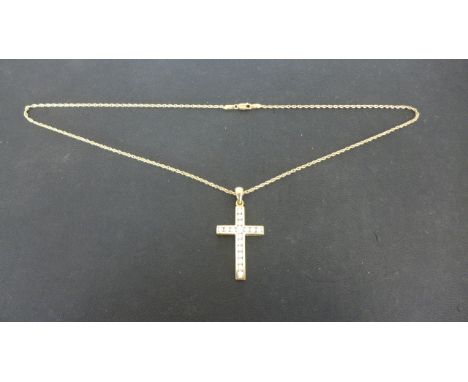An 18ct Yellow Gold Crucifix set with seventeen diamonds on an 18ct Yellow Gold Chain, approx 8 grams - in very good conditio