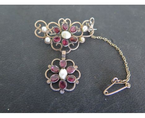 A 19th century 18ct gold garnet and pearl brooch - approx weight 4.6 grams - in good condition, complete with safety chain