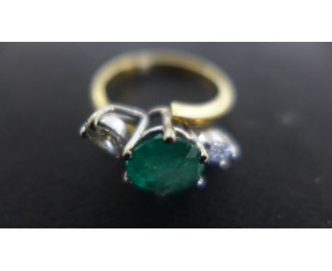 An 18ct Yellow Gold Ring - the central round cut emerald approx 1.6ct flanked by two marquise cut diamonds, approx 0.13ct, ea