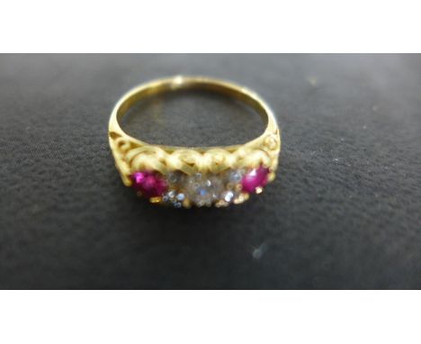 An 18ct Yellow Gold Ruby and Diamond Gypsy Ring, five diamonds approx 0.28 to centre flanked by two fine rubies 0.35ct, appro