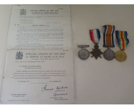 A World War I Trio consisting 1914-15 Star, a 1914-18 War Medal, a Victory Medal with a Long Service and Good Conduct Medal, 