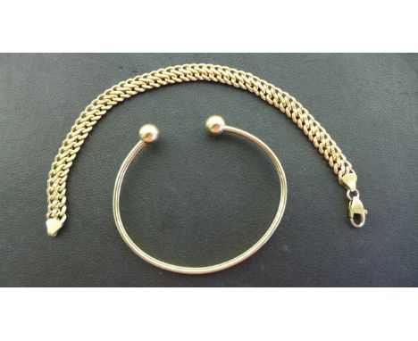 A 9ct Yellow Gold Link Bracelet - 19 cm long, approximately 5.3 grams and a metal filled 9 ct Gold Bangle - both good conditi