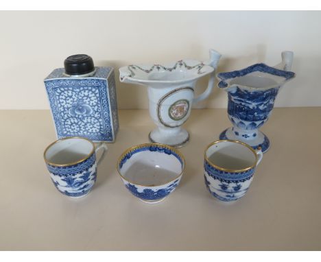 A Chinese 18th Century Blue and White Tea Caddy with a Wooden Lid, together with two Helmet-shaped Jugs, two Blue and White C