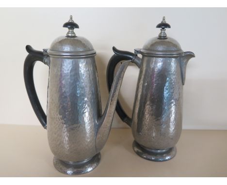 A Tudric Pewter Tea-Pot and Coffee pot - both with hammered finish - both in good order - finial to Coffee pot slightly depre
