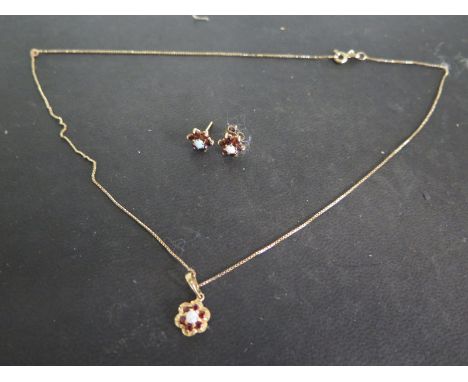 A 9ct Gold Necklace and Earring Set - with Opal and Garnets - in good condition - one earring missing clasp