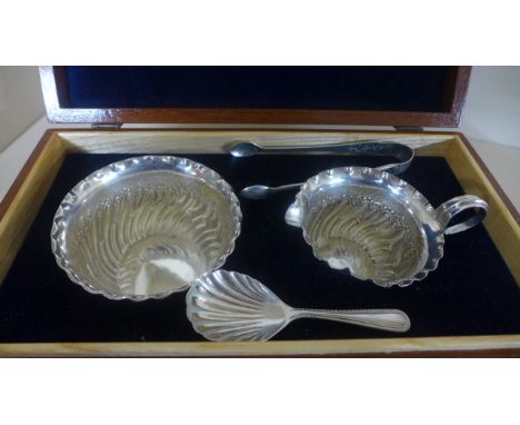 A boxed Silver Hallmarked bowl and jug, Hallmark for Sheffield 1887-88 - both with embossed foliate decoration - maker James 