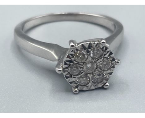 Ladies 9ct white gold diamond cluster ring featuring 7 round brilliant cut diamonds 2.88g size L1/2