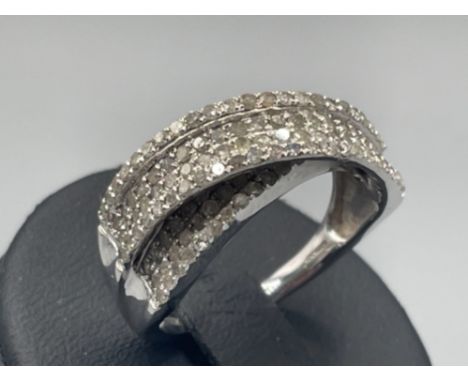 Ladies 9ct white gold diamond cluster crossover ring comprising of 132 round brilliant cut diamonds 5.25g size O