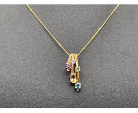 Ladies 9ct gold Stone set pendant and 9ct gold fine chain. Pendant set with oval citrine, round blue topaz, round peridot, ro