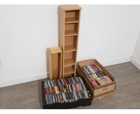 2 boxes of DVDs and CDs plus cd and dvd towers
