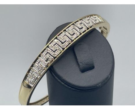 Ladies gold Versace style diamond bangle, set with 43 round brilliant cut diamonds complete with safety catch 12.70g