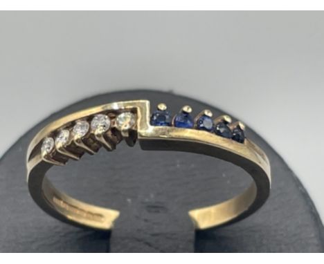 Ladies 9ct gold sapphire and diamond ring. 2.06g size O