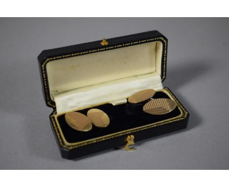 A Cased Pair of Gilt Silver Cuff Links with Engine Turned Decoration.