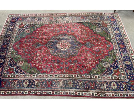 Multi coloured ground vintage Iranian handwoven carpet with floral medallion 296cm by 202cm