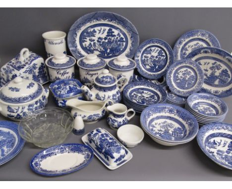 Large collection of Willow pattern dinner and tableware includes cheese plate and cover, tureen, tea, coffee, sugar, teapot, 