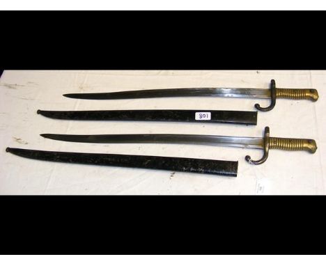 A sword bayonet with metal scabbard - 72cm long, together with one other CONDITION REPORTscabbards - 1 has serial number matc