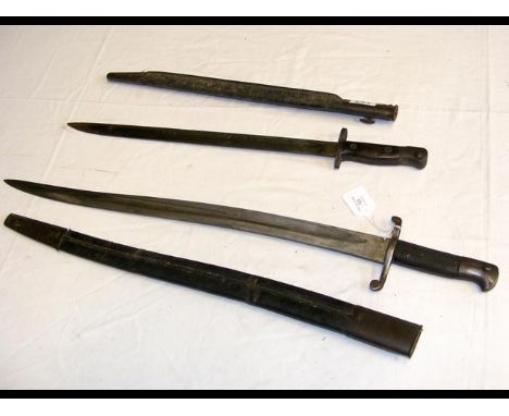 An antique long sword bayonet with leather scabbard - 72cm long, together with a 59cm ditto 