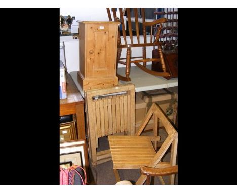 A pine bedside table together with three fold down slat seat garden chairs