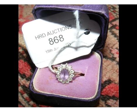 A ladies purple and CZ ring in 9ct setting