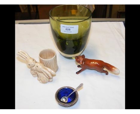 A studio green glass vase with silver table salt and some pieces of ceramic ware