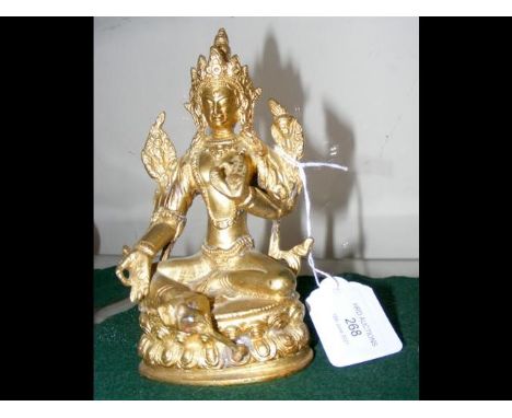 A 15cm high gilt bronze deity