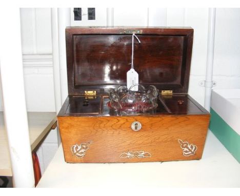 An antique tea caddy with inlaid mother-of-pearl 
