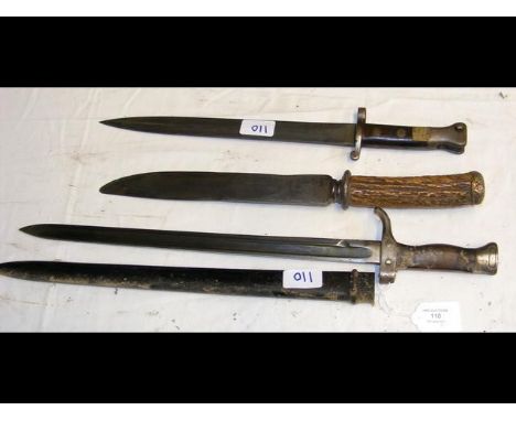 A sword bayonet with metal scabbard - 53cm long, together with one other lacking scabbard and a hunting knife 