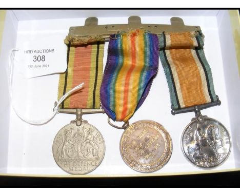 Two First World War medals - Private Buckett, together with a Second World War medal