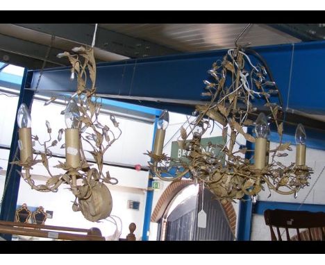 A decorative metal ceiling light together with matching wall light
