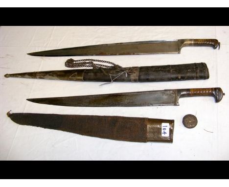 An unusual Middle Eastern sword with decorative grip and leather scabbard - 81cm long, together with one other CONDITION REPO