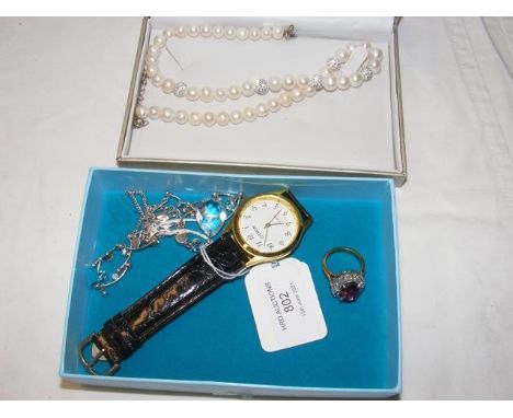 A ladies dress ring together with a decorative necklace and watch