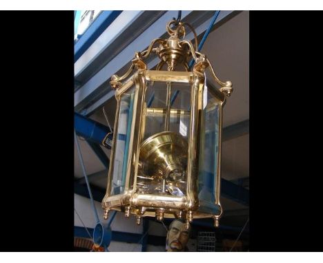 A brass six sided porch light