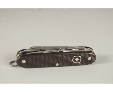 A SWISS VICTORINOX COMBINATION KNIFE.
