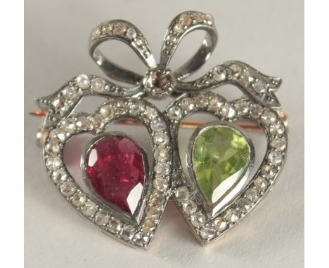 A DIAMOND, PERIDOT AND RUBY HEART BROOCH.