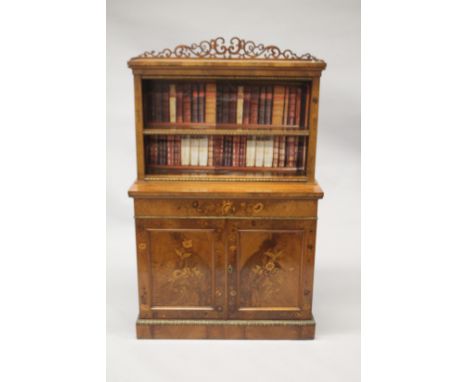 A 19TH CENTURY WALNUT STANDING BOOKCASE, the top with pierced fretwork, single shelf and faux books, the base with double pan