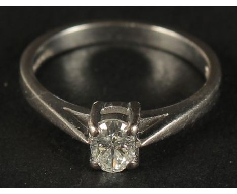A CERTIFICATED 18K WHITE GOLD OVAL-CUT DIAMOND SOLITAIRE RING, boxed. Diamond 0.33ct, H, SI. Cert No. WGI9624144945.