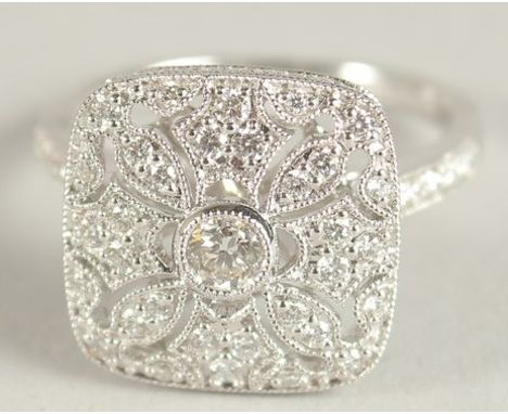 AM 18CT WHITE GOLD AND DIAMOND ART DECO DESIGN RING, with diamond set bezels and shoulders.