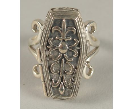 A SILVER COFFIN RING.